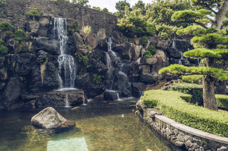 Jeju Island, South Korea, september 05, 2019: scenic view of waterfall inside of spirited gardenの写真素材
