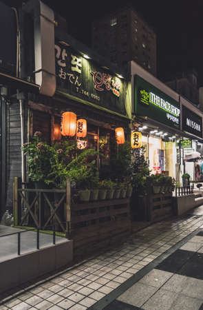 Jeju, South Korea, september 09, 2019: glowing signboards and exteriors of korean shops in Jeju city...