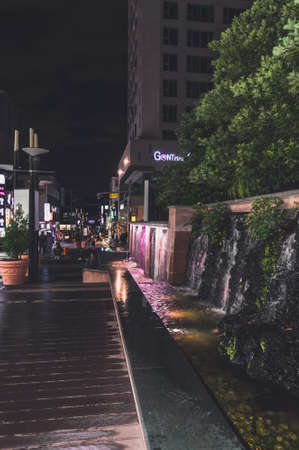 Jeju, South Korea, september 09, 2019: Night view of  artificial waterfall decorating shopping and walking street at Jeju cityのeditorial素材