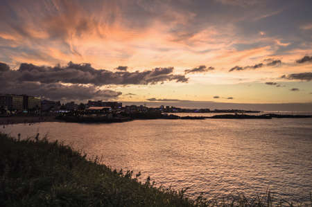 night cityscape view from Hamdeok Beach at sunsetの写真素材