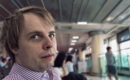 Portrait of man waiting for his boarding in the airport