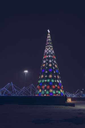 illuminted christmas tree in park of Nur Sultan at winter nightの写真素材