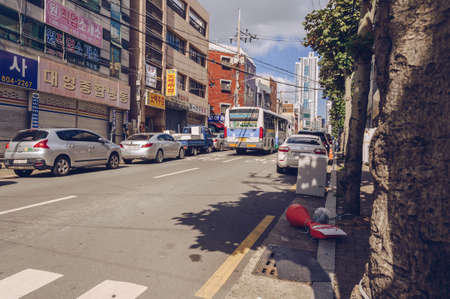 Busan, South Korea September 13, 2019: parked cars at both sides of one of Busan roads on sunny holiday dayのeditorial素材