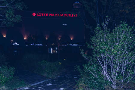 Busan, South Korea, September 12, 2019: view from nearby park on  glowing singboardof Lotte premium...