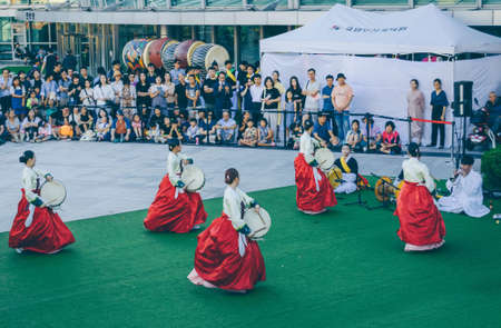 Busan, South Korea, September 13, 2019: tarditional korean dancers in hanbok performing with their drumsのeditorial素材