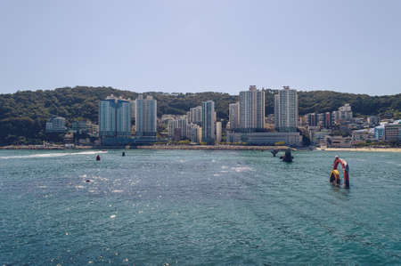 view of the sparkling sea waves at Songdo beach in Busan on sunny dayの写真素材