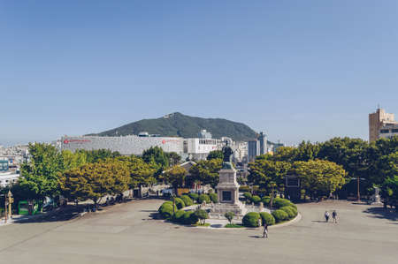 Busan, South Korea, September 14, 2019: view of cityscape from yongdusan park square with admiral Yi...