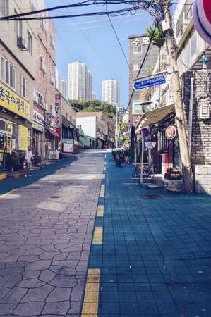 Busan, South Korea, September 14, 2019: view of one of the typical narrow korean street with shops...