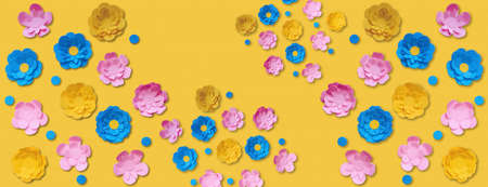 colorful banner decorated with cute paper flowers on yellow backgroundの写真素材