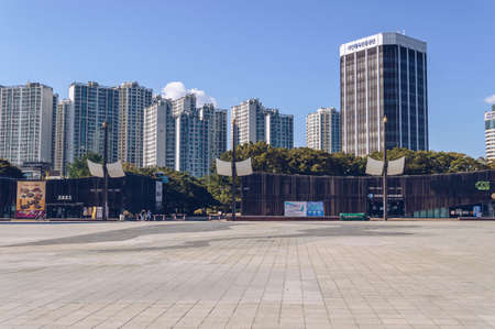 Seoul, South Korea â€“ 16 September 2019 : cafe facades on sunny day with cityscape and blue...