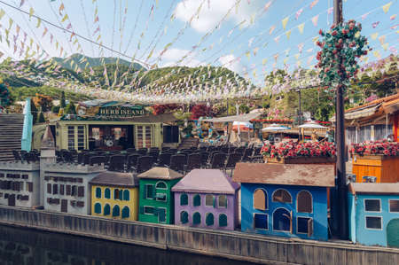 Pocheon, South Korea â 10 May, 2017: Thematic part of Herb Island "Venezia" decorated  with carnival flags colorful mini houses and flowersのeditorial素材