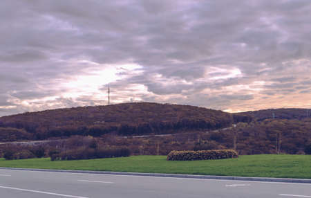 sunset view with autumn forest and roads of Russkiy islandの写真素材