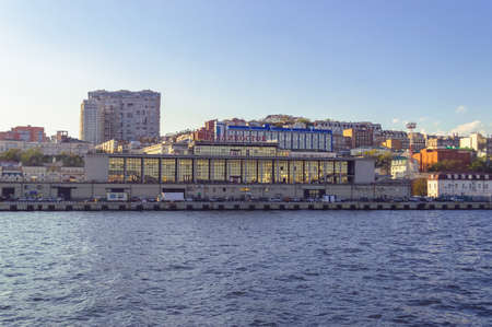 Vladivostok, Russia - October 07, 2020: view from the sea on exterior of sea port and cityscapeのeditorial素材