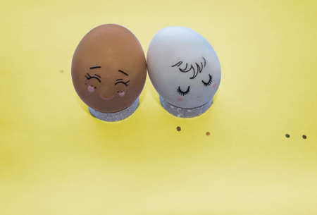 cute easter eggs white and brown on yellow background