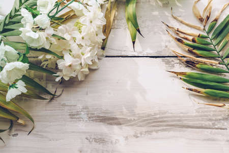 summer background with palm leaves and hydrangea flowers in bloom and copy space on wooden backgroundの写真素材