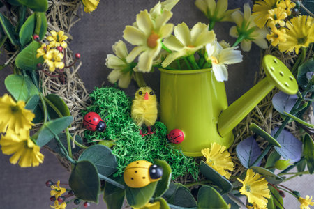 cute and bright watering can with ladybugs and flowers  as home decor