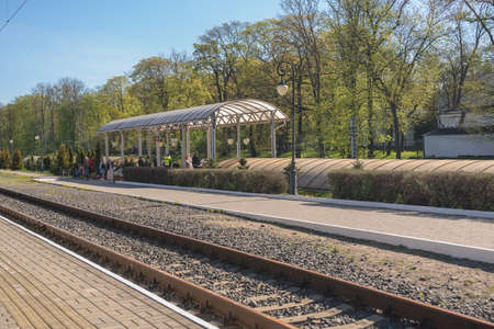 Kaliningrad, Russia - may 11, 2021: passengers at the railway station and railway tracks view