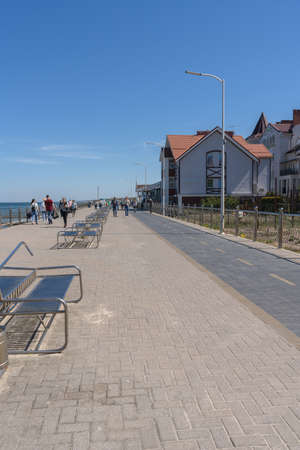Zelenogradsk, Russia - may 11, 2021: promenade near Baltic sea with walking and relaxing people on sunny dayのeditorial素材