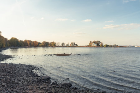 shore of Peterhof with view on  Imperial Yachts Museum at sunset in autumnの写真素材