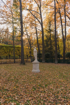 Petergof, Russia - October 2, 2021: Decorative sculpture of Bacchus with sun on the autumn dayのeditorial素材