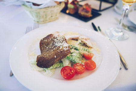 top view of serving of salad with black bread croutonの写真素材