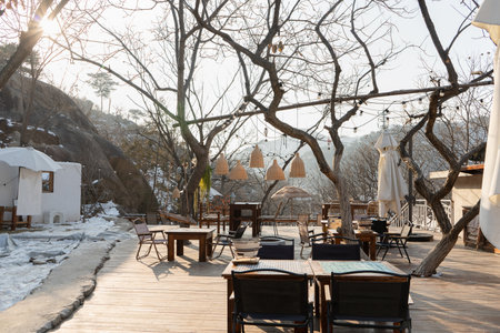 dining outdoor area of small cafe in China in the winter morning with shining sunの写真素材
