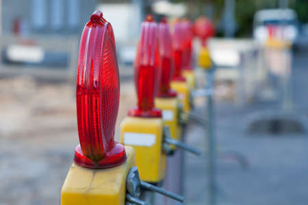 Cordon with warning lights at a construction site.の写真素材