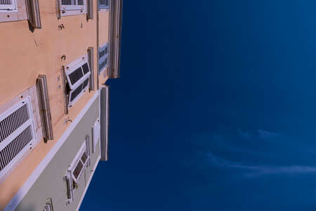 Building in front of a fairly clear blue skyの写真素材