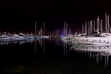 Marina full of boats at nightの写真素材