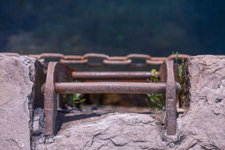Rusty metal boarding ladder in a marineの写真素材