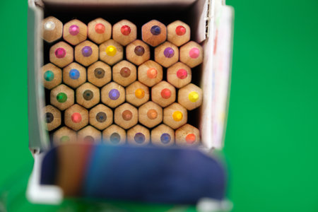 Pencils in a box on a green background, close-upの写真素材