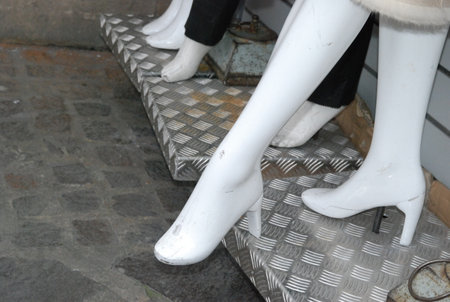 Closeup of the legs of a mannequin in the streetの写真素材