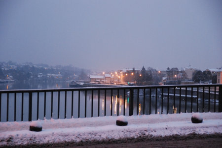 View of the city from the bridge over the river in winter.の写真素材