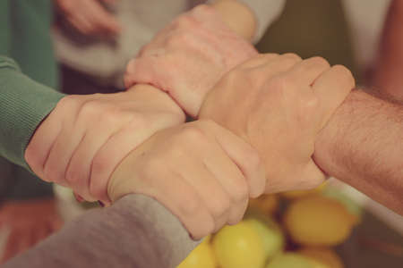 Family holding hands. A symbol of togetherness, unity, teamwork and love.の写真素材