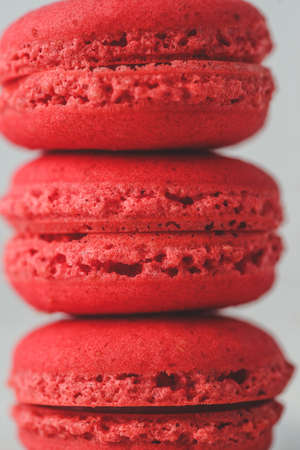 Red macarons arranged one over another. Close up.の写真素材