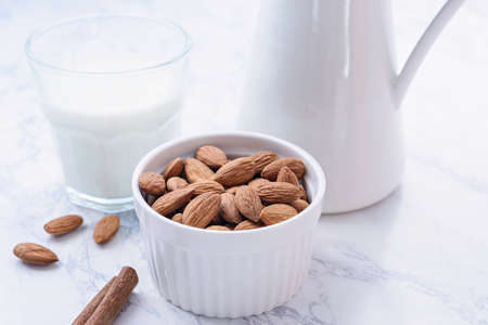 Organic homemade almond milk on light background.の写真素材