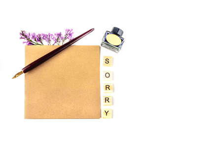 Lilac, pen, ink cartridge and postcard of craft paper on white background. Flat lay, top view, copy space. Concept of excuse, apology and pity for what happened.の写真素材