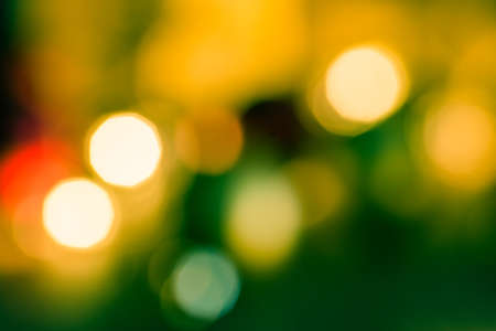 Christmas Tree Lights Bokeh Blurred Out of Focus for background abstract. Festive Gift of Happiness and the New Year celebrations.の写真素材