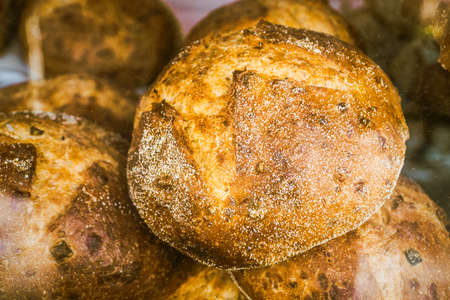 Freshly baked and crunchy home made corn bread on display in a shop. Gluten free bread suitable for...