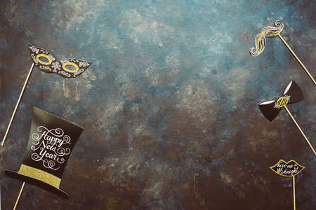 New year and Christmas party props accessories on dark vintage background. Happy new year 2020 party...