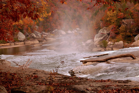 The Cumberland river in autumn.  Mist rises from the Cumberland River, in southeastern Kentucky, as seen from the top of the Cumberland Falls.の写真素材
