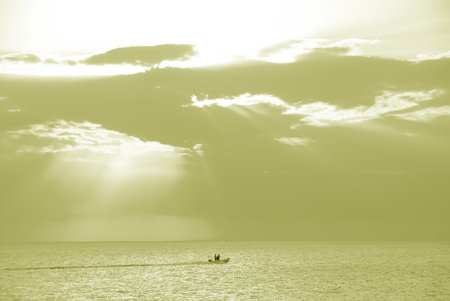 Golden Waters, Gulf of Mexico - Boating over the water of the Gulf of Mexico at Ft Meyers Beach in December.の写真素材