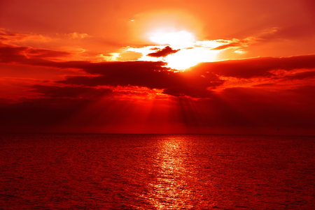 Sunset, Gulf of Mexico - A brilliant sunset over the water of the Gulf of Mexico at Ft Meyers Beach in December.の写真素材