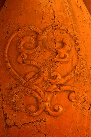 Baked Earth Terra Cotta -  macro image of a large terra cotta urn with cracks for use as an overlay or background.の写真素材