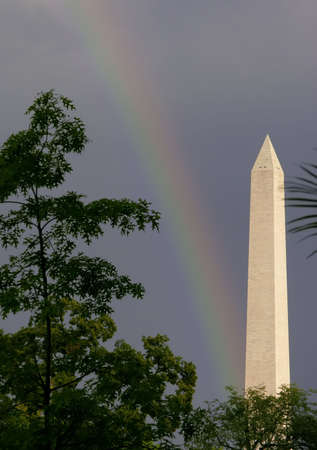 The Washington Monument after a rain shower with a rainbow.の写真素材