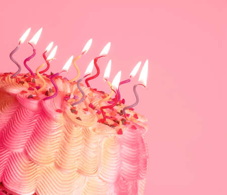 Birthday Cake - A birthday cake with swirly lighted candles on top. の写真素材