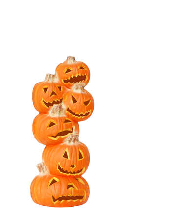 Stack of Halloween Pumpkins - A carved jack o lantern pumpkin stack isolated on white with space for copy.の写真素材