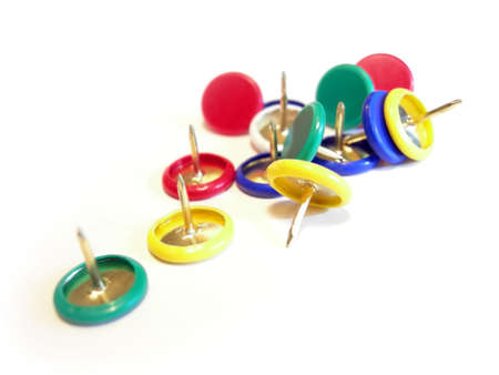 Closeup of a several push pins in different colors          
