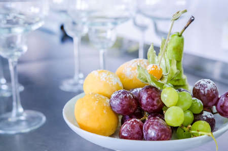 Delicious fruits salad in plate, receptionの写真素材