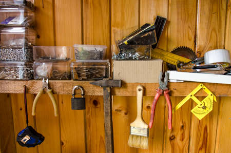 Organized wall of tools. Workplace with a lot of old toolsの写真素材